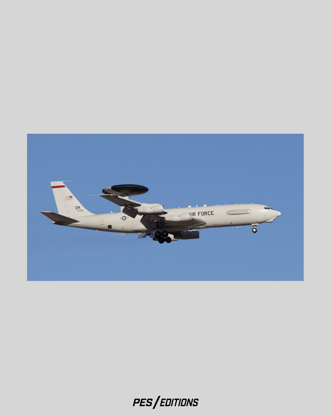 Majestic profile study of a Boeing E-3G Sentry AWACS airborne command aircraft, Tail 77-0356 carrying the 'OK' tail code from Tinker AFB, showcasing its rotating radar dome against a blue sky by Phil Schmauder.
