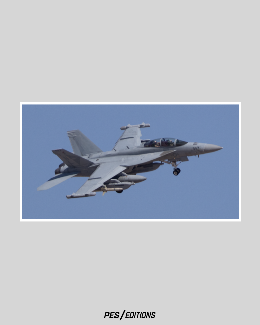 A US Navy EA-18G Growler electronic warfare jet on approach. The specialized airframe carries distinctive wingtip jamming pods.