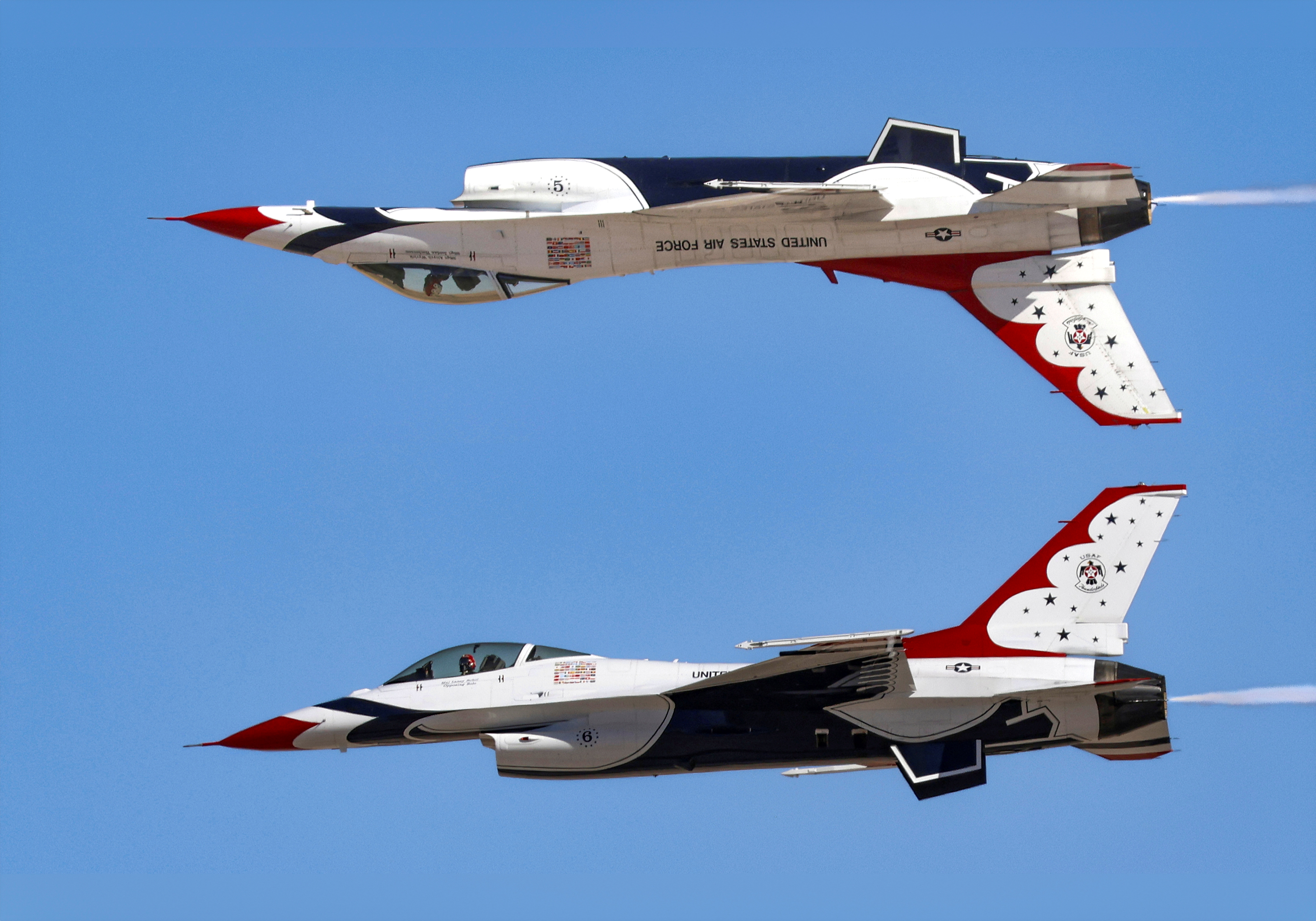 USAF Thunderbirds F-16 fighters performing an inverted Calypso Pass in flight